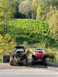 Two SxS's in front of the Hatfield Cemetery where Devil Anse is buried.